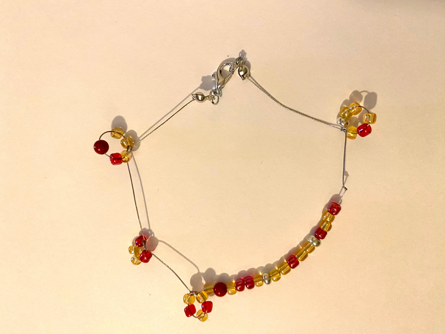 Pale Yellow Red Beaded Circle Bracelet